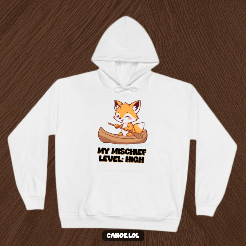 Funny playful fox cub balancing in a canoe with a mischievous grin, a cozy and humorous hoodie.