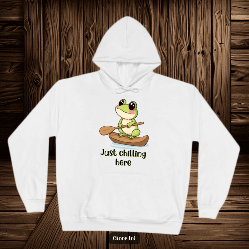 Funny Hoodie depicting a cheerful frog balancing on the end of a canoe paddle, great for cozy adventures.