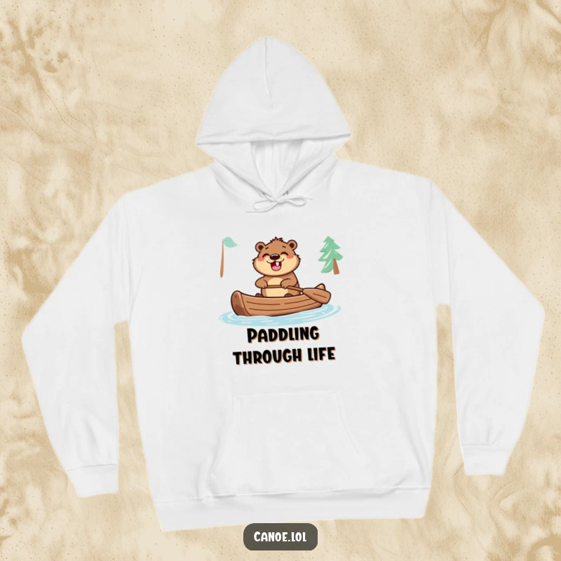 Funny hoodie featuring an excited beaver with a wide grin, paddling a canoe, perfect for cozying up after outdoor adventures.